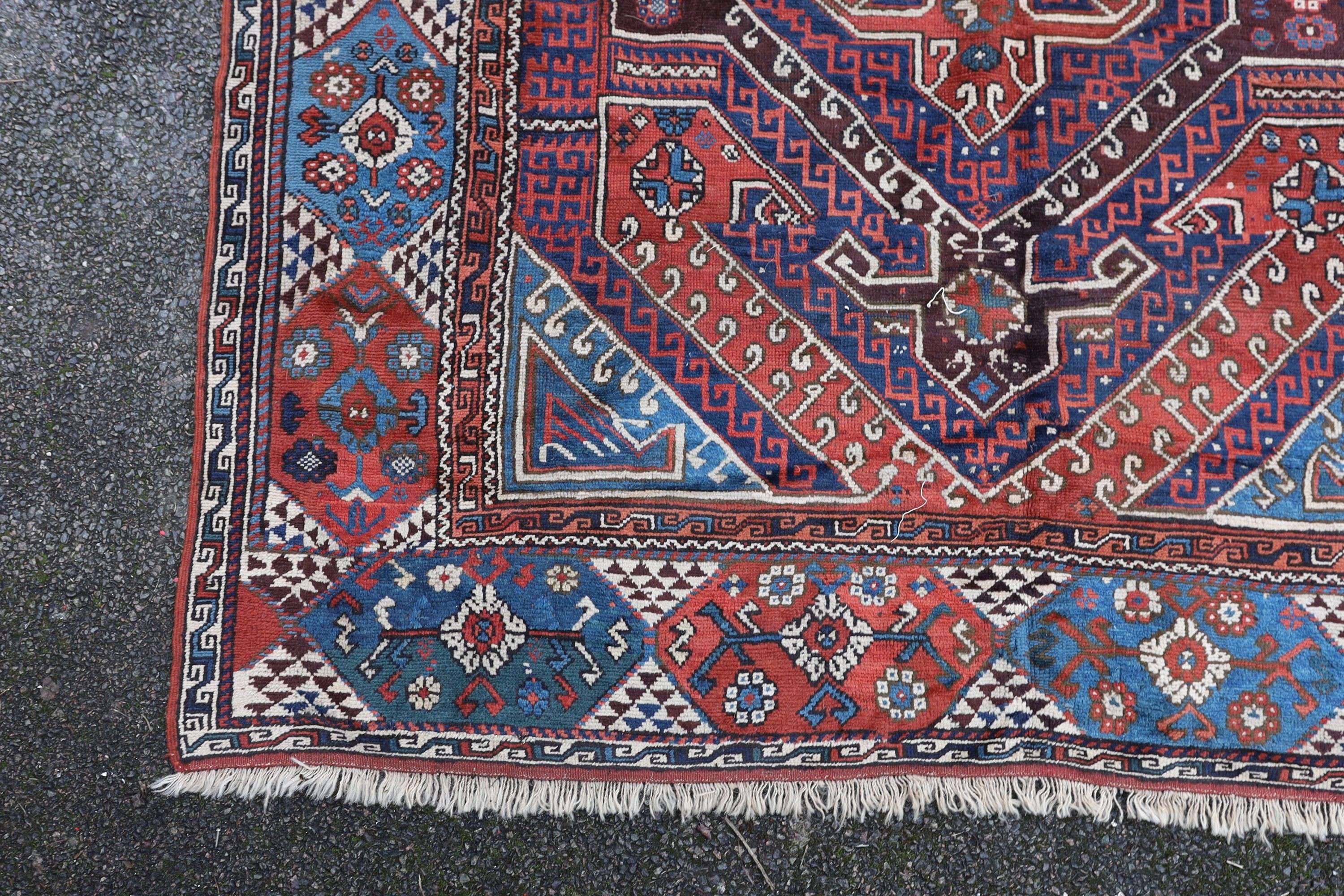 A Bergam Turkish blue ground rug 254 x 198cm